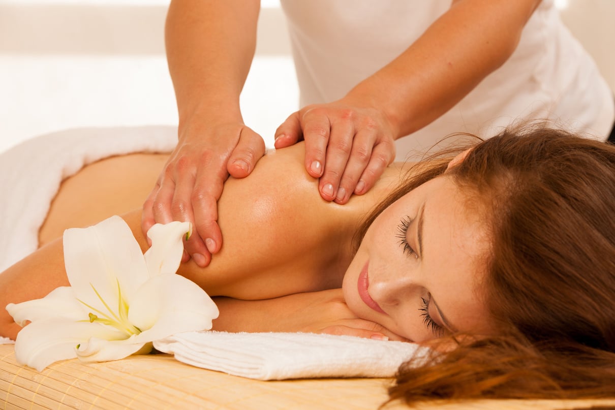 Body Care. Spa Body Massage Treatment. Woman Having Massage in T